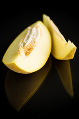Studio shot of notched ripe melon galia with slice