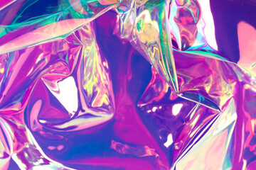 Purple liquid texture. Defocused colorful realistic wrinkled holographic material background.