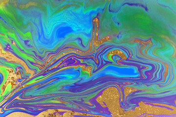 Abstract gold and blue liquid pattern.