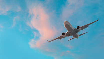 Airplane in the sky at sunset