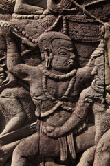 Fototapeta na wymiar The temple complex of Angkor Watt, Cambodia wall relief depicting ancient wars