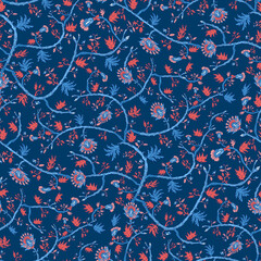 Obraz premium Seamless tropical floral pattern with indian motif. Stylized flowers and branches waves or arches colored blue and orange. Spiral vine plant indian textile