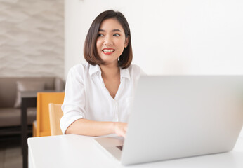 Asian business lady working in a random cafe