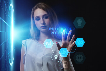 Business, Technology, Internet and network concept. Young businessman working on a virtual screen of the future and sees the inscription: Unlock your potential