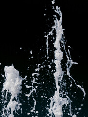 abstract splash of a jet of water on a black background