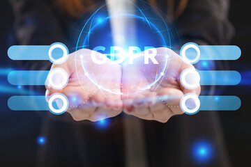 Business, Technology, Internet and network concept. Young businessman working on a virtual screen of the future and sees the inscription: GDPR