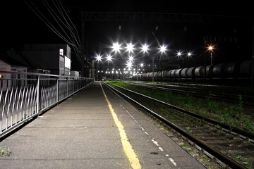 Lights from lanterns over the train station at night