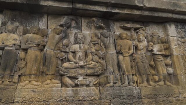 Candi Borobudur - Mahayana Javanese Buddhist Temple UNESCO World Heritage Site - Beautiful Buddha Reliefs in Yogyakarta Magelang, Central Java, Indonesia Indonesians