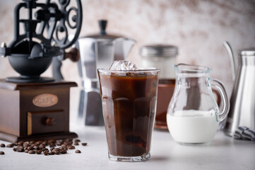 black iced coffee with milk and tools