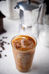 iced coffee with milk and dripping tools