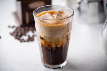 iced coffee with milk and dripping tools