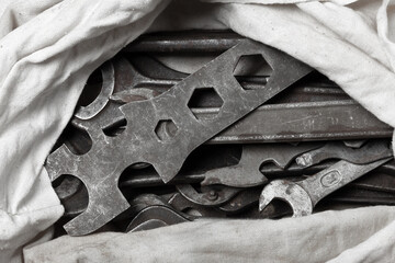 Old wrenches in a canvas bag