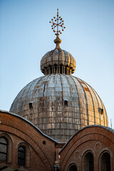 Fototapeta na wymiar Close up of the beautiful Dome of St Mark's Basilica covered in the morning light of Venice 01