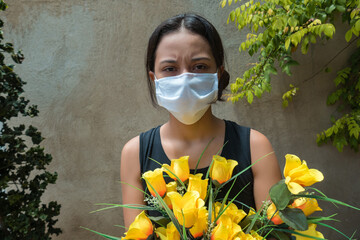 woman in mourning, dressed in black and wearing flowers during a funeral