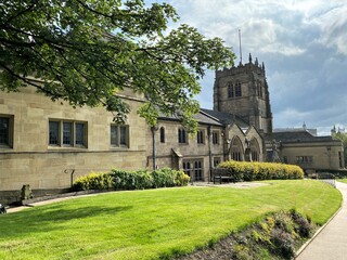 View of the back of the Bradford Cathedral, with a grass lawn in the foreground