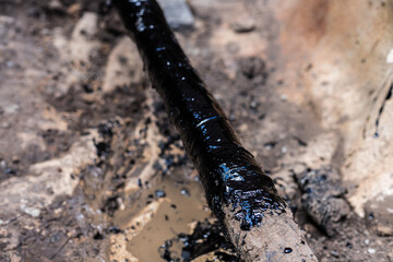 gas pipe in resin. Resin-treated pipe treated with resin.