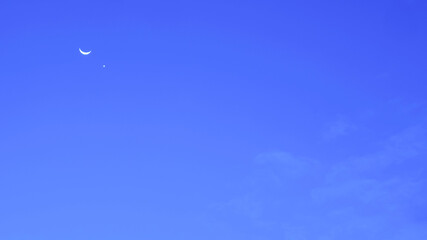 Crescent moon with star and white cloud in blue night sky, Natural night sky background in minimal...