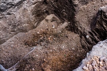 Earthworks. Shovel in the ground in the garden. A bayonet spade in the garden. Digging up the soil on the suburban area. Land works with a trench tool.
