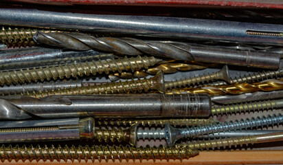a set of various screws and anchor bolts for installation repair and maintenance close up