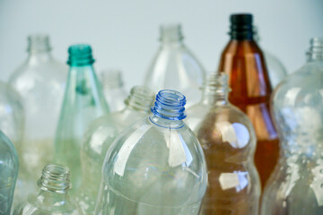 Plastic bottles for water and drinks in a white plastic box