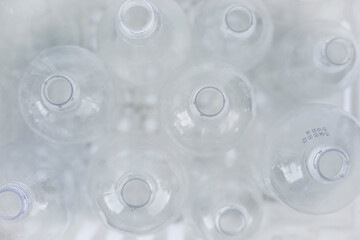 Plastic bottles in a box on a white background