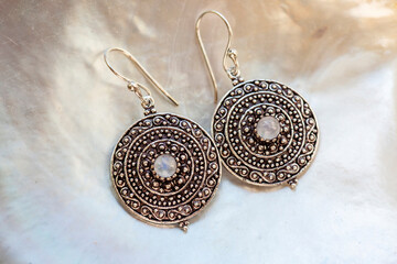 Lovely female Metal earrings in mandala shape with moon stone