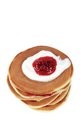 Stack of pancakes with sour cream and raspberry jam on white background