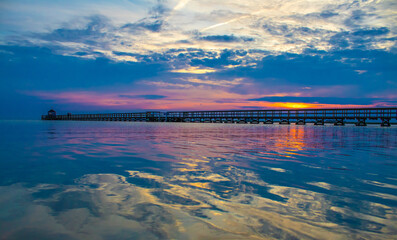 sunset behind the bridge in Hestehoved Beach, Lolland, Denmark