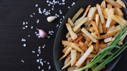 fried potatoes on a cast iron plate