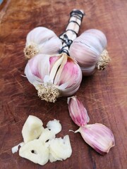 Garlic clove with cut and whole bulbs
