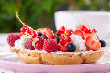 dessert with fresh berries on a white background. Sweet roll