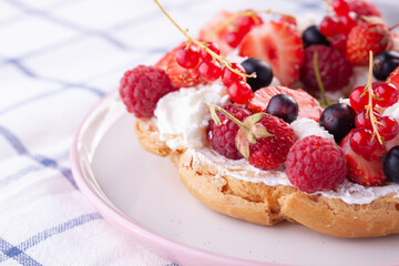 dessert with fresh berries on a white background. Sweet roll
