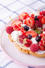 dessert with fresh berries on a white background. Sweet roll
