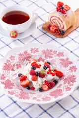 dessert with fresh berries on a red vintage plate. Farm cottage cheese