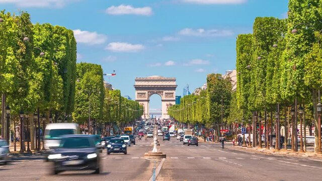 4k timelapse of Paris cityscape, Arch De Triumph (Arch De Triomphe) on Champs Elysees in Paris and the traffic,the most famous landmarks monuments in Paris