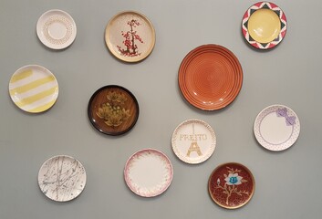 Many decorative plates on a wall