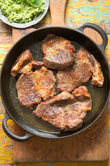 Pork shoulder in white wine with broad beans & herbs pesto