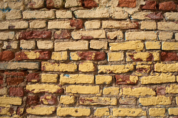 very old yellow brick wall background