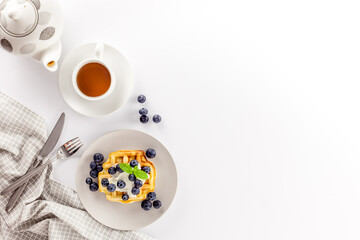 Homemade belgian waffles on served table on white background top view mockup