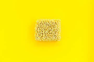 Instant noodle on Yellow background top view copy space mockup