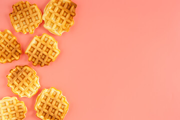 Traditional belgian waffles on pink background top view mockup