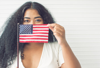 African woman holding american flag
