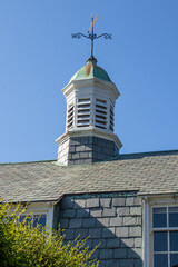 Cupola of Gambrel Roof Carriage House with Weathervane