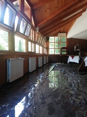 Ruined restaurant interiors. flooding damages, big damage done by a small mountain river that...