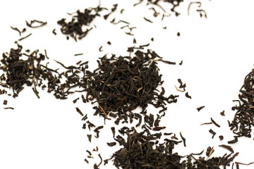 Leaves of black premium dry tea on a white background