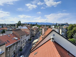 Streets of Zagreb, Croatia, on a sunny day, seen from the 6th floor, with Medvednica mountain in the background