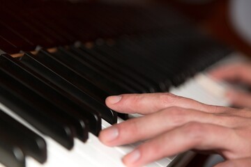 Hands on Piano Keyboard - Close Up