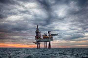 Offshore oil rig at sunset
