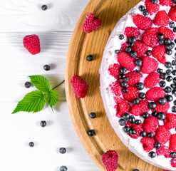 raspberry cake and many fresh raspberries