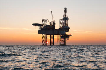 Offshore oil rig at sunset